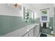 Elegant bathroom featuring a granite countertop vanity with Hollywood-style vanity mirror at 8752 Washington Blvd E Dr, Indianapolis, IN 46240