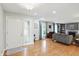 Open living room featuring hardwood flooring, large windows, and a fireplace at 8752 Washington Blvd E Dr, Indianapolis, IN 46240