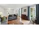 Inviting living room with hardwood floors, large windows, and stylish furnishings at 8752 Washington Blvd E Dr, Indianapolis, IN 46240