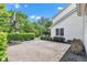 View of the large backyard featuring well maintained hedges and a basketball hoop at 8973 Carnation Dr, Noblesville, IN 46060