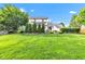 Expansive lawn with outdoor dining area, patio, and firepit at 8973 Carnation Dr, Noblesville, IN 46060