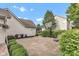 View of the large backyard featuring well maintained hedges, a basketball hoop, and a single lounge chair at 8973 Carnation Dr, Noblesville, IN 46060
