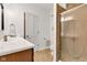 This bathroom features a single sink, updated fixtures, toilet, and a shower with glass doors at 8973 Carnation Dr, Noblesville, IN 46060