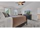 Comfortable bedroom featuring television, sitting area, and soft grey carpet at 8973 Carnation Dr, Noblesville, IN 46060