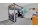 Cozy bedroom featuring a unique loft bed with built-in desk and shelving for functional space at 8973 Carnation Dr, Noblesville, IN 46060