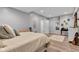 View of bedroom featuring wood-look flooring, neutral paint and a comfy bed with a large window at 8973 Carnation Dr, Noblesville, IN 46060
