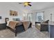 Comfortable bedroom featuring a ceiling fan and sitting area next to bright window views at 8973 Carnation Dr, Noblesville, IN 46060