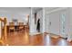 Inviting foyer with hardwood floors, natural light, and views into the formal dining room at 8973 Carnation Dr, Noblesville, IN 46060