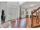 Grand foyer with hardwood floors, tall ceilings, lots of windows and an elegant staircase at 8973 Carnation Dr, Noblesville, IN 46060