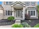 Close up of the front entrance, enhanced by professional landscaping and tasteful decor at 8973 Carnation Dr, Noblesville, IN 46060