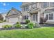 Close up of the front entrance and three car garage, enhanced by professional landscaping at 8973 Carnation Dr, Noblesville, IN 46060