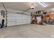 A clean garage featuring epoxy floors and a large two car garage door at 8973 Carnation Dr, Noblesville, IN 46060