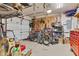 A clean garage featuring epoxy floors, large door, and plenty of storage including bicycles at 8973 Carnation Dr, Noblesville, IN 46060