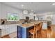 Stylish kitchen with a granite island, pendant lighting, and modern appliances at 8973 Carnation Dr, Noblesville, IN 46060