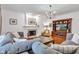 Spacious living room features a fireplace, large TV, and comfortable couches at 8973 Carnation Dr, Noblesville, IN 46060