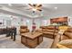 Finished basement living room featuring a brown leather sofa, stairs, and small kitchenette at 8973 Carnation Dr, Noblesville, IN 46060