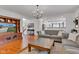 Comfortable living room with a couch, TV, and staircase view at 8973 Carnation Dr, Noblesville, IN 46060