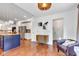 Open concept living space showcases the kitchen island, living area, and access to other parts of the home at 8973 Carnation Dr, Noblesville, IN 46060