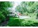 A beautiful home showcases a backyard oasis with a sparkling pool and an expansive lawn at 9154 Sargent Manor Ct, Indianapolis, IN 46256