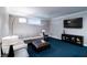 Cozy basement with stylish sectional sofa, entertainment center, and a large screen TV at 9154 Sargent Manor Ct, Indianapolis, IN 46256