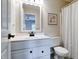 Clean bathroom with white vanity, updated fixtures, and shower curtain at 9154 Sargent Manor Ct, Indianapolis, IN 46256