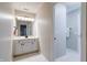 Bright bathroom featuring a white vanity and bright vanity lights at 9154 Sargent Manor Ct, Indianapolis, IN 46256