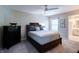 Bedroom with a dark wood bed frame, two windows, and a dresser at 9154 Sargent Manor Ct, Indianapolis, IN 46256