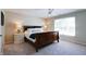Bright bedroom with a dark wood bed frame, two nightstands, and a window at 9154 Sargent Manor Ct, Indianapolis, IN 46256