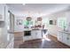 Bright, open kitchen with an island and modern appliances, and natural lighting overlooking a patio at 9154 Sargent Manor Ct, Indianapolis, IN 46256