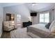 Comfortable main bedroom with vaulted ceiling and a peek into the bathroom at 9154 Sargent Manor Ct, Indianapolis, IN 46256