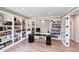 A bright office with custom built-ins provides ample storage and an elegant workspace at 9154 Sargent Manor Ct, Indianapolis, IN 46256