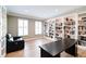 Home office area features custom built-in shelving and bright window views at 9154 Sargent Manor Ct, Indianapolis, IN 46256