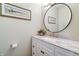 A stylish powder room with a marble countertop and tasteful decor at 9154 Sargent Manor Ct, Indianapolis, IN 46256