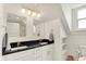 Elegant bathroom with granite countertops, dual sinks, and a window that brings in natural light at 1015 N Beville Ave, Indianapolis, IN 46201