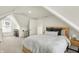 Charming bedroom with neutral carpet, ample closet space, and an attic window for natural light at 1015 N Beville Ave, Indianapolis, IN 46201