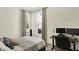Bright bedroom featuring a desk and two windows providing natural light at 1015 N Beville Ave, Indianapolis, IN 46201