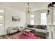 Cozy living room with a comfortable seating area, decorative lighting, and hardwood floors at 1015 N Beville Ave, Indianapolis, IN 46201