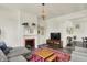Inviting living room with a fireplace, comfortable seating, and hardwood floors at 1015 N Beville Ave, Indianapolis, IN 46201