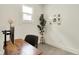 Cozy home office area featuring a modern desk, chair, and natural lighting at 1015 N Beville Ave, Indianapolis, IN 46201