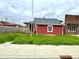 Charming single Gathering home featuring red siding, a new gray roof, and a partially covered side porch at 104 W Pearl St, Trafalgar, IN 46181