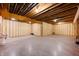 Unfinished basement featuring exposed wood beams, insulation, and a concrete floor at 10505 Golden Bear Way, Noblesville, IN 46060