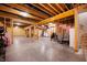 Unfinished basement featuring exposed wood beams and a concrete floor ready to customize at 10505 Golden Bear Way, Noblesville, IN 46060