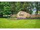 Stone Sagamore of Noblesville entrance sign surrounded by trees and well-manicured landscaping at 10505 Golden Bear Way, Noblesville, IN 46060