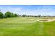 Scenic golf course view with rolling green hills, mature trees, and sand traps at 10505 Golden Bear Way, Noblesville, IN 46060