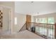 Hallway with hardwood floors and staircase at 10505 Golden Bear Way, Noblesville, IN 46060