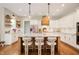 Stylish kitchen featuring a center island, white cabinetry, and stainless steel appliances at 10505 Golden Bear Way, Noblesville, IN 46060