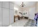 Functional mudroom with custom cabinetry, bench seating, and decorative lighting at 10505 Golden Bear Way, Noblesville, IN 46060