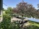 Outdoor deck overlooking a tranquil pond, perfect for relaxation and entertaining in a serene setting at 11014 Lake Run Dr, Fishers, IN 46038