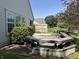Large backyard deck with built-in seating, offering a great space for outdoor gatherings and leisure at 11014 Lake Run Dr, Fishers, IN 46038