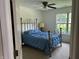 Comfortable bedroom with a ceiling fan and natural light from the window at 11014 Lake Run Dr, Fishers, IN 46038